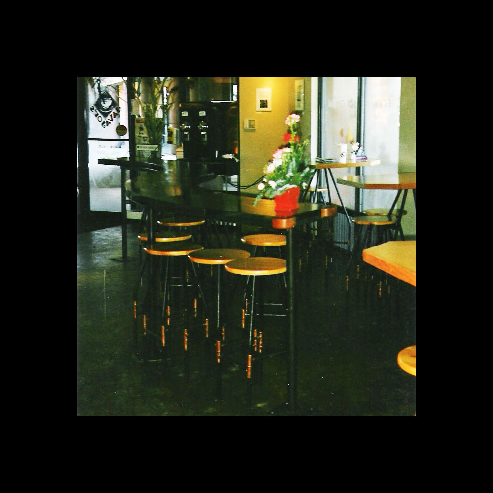 Serpentine coffee shop table and stools